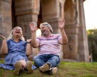 Happy elderly couple enjoying a short outing outdoors, uplifting their mood and breaking daily monotony – Saral Satya Legacy